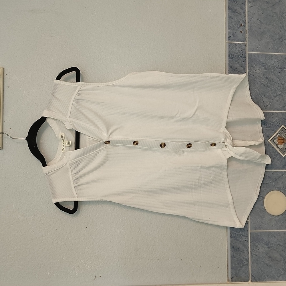 White sleeveless button-down blouse